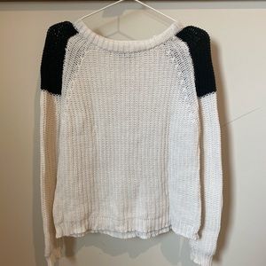 White sweater with black shoulder detail